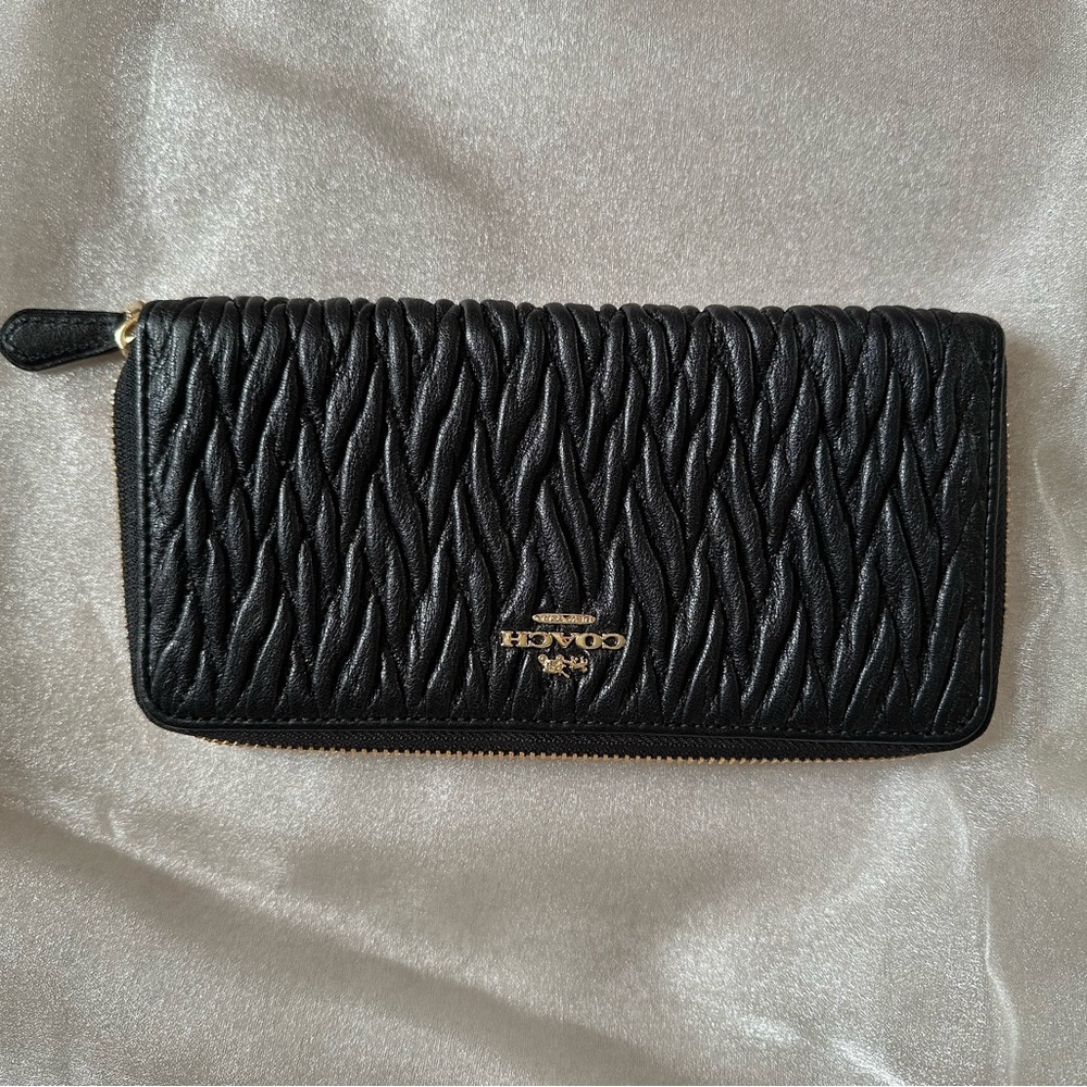 Coach Black Leather Wallet with Quilted Texture and Zipper Closure